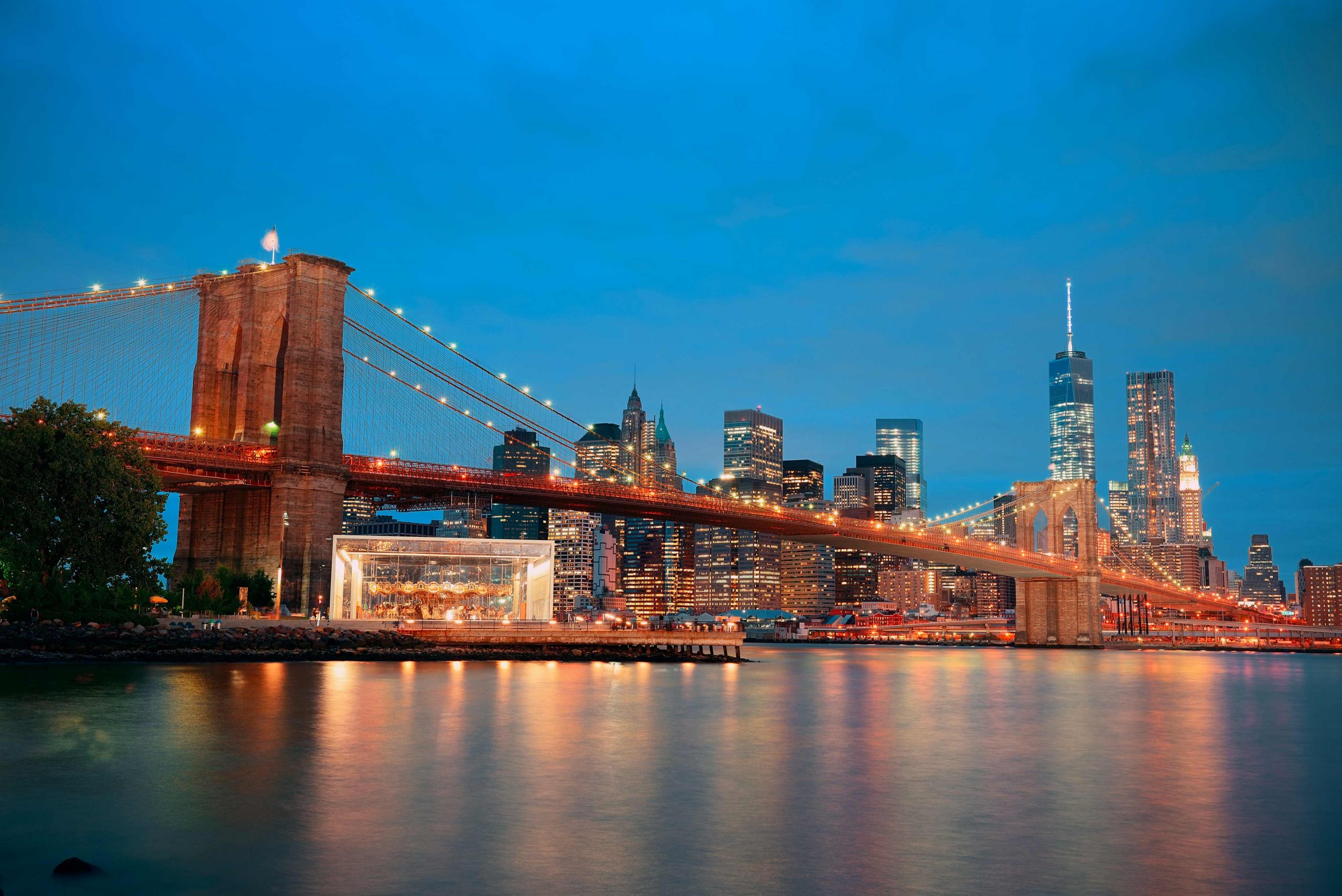 manhattan-downtown-urban-view-with-brooklyn-bridge-at-night-1-scaled